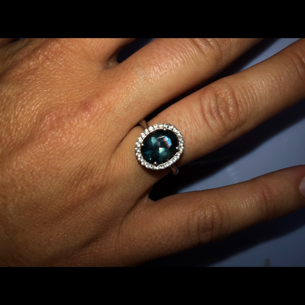 Blue topaz and white sapphire halo sterling ring